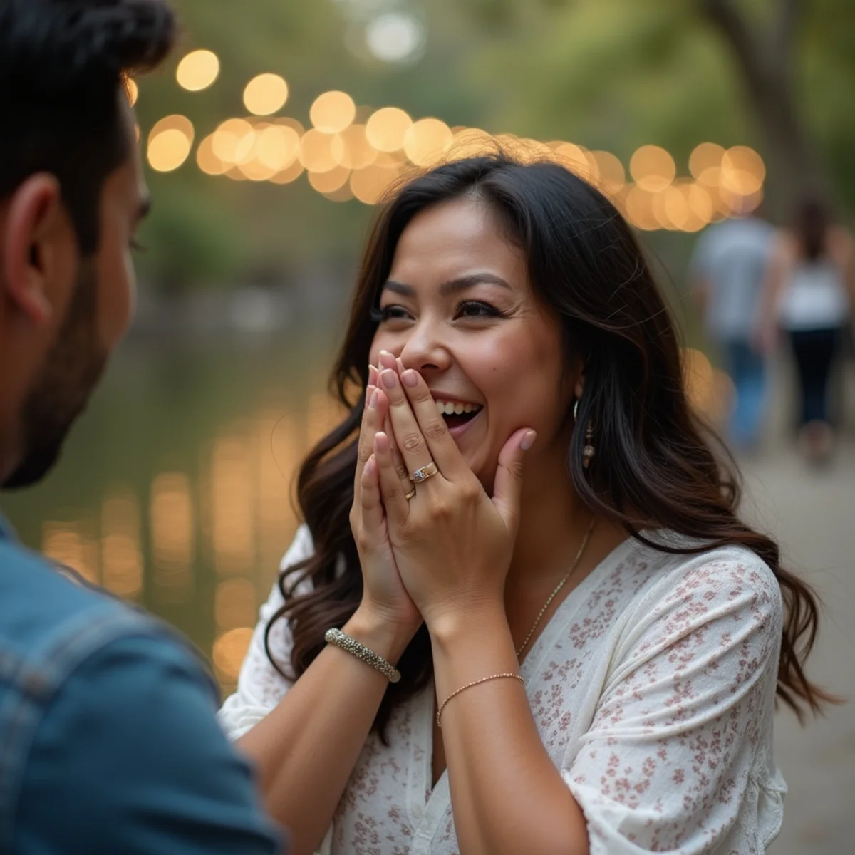 Woman reacting with her hands to her face during a surprise proposal on the San Antonio River Walk